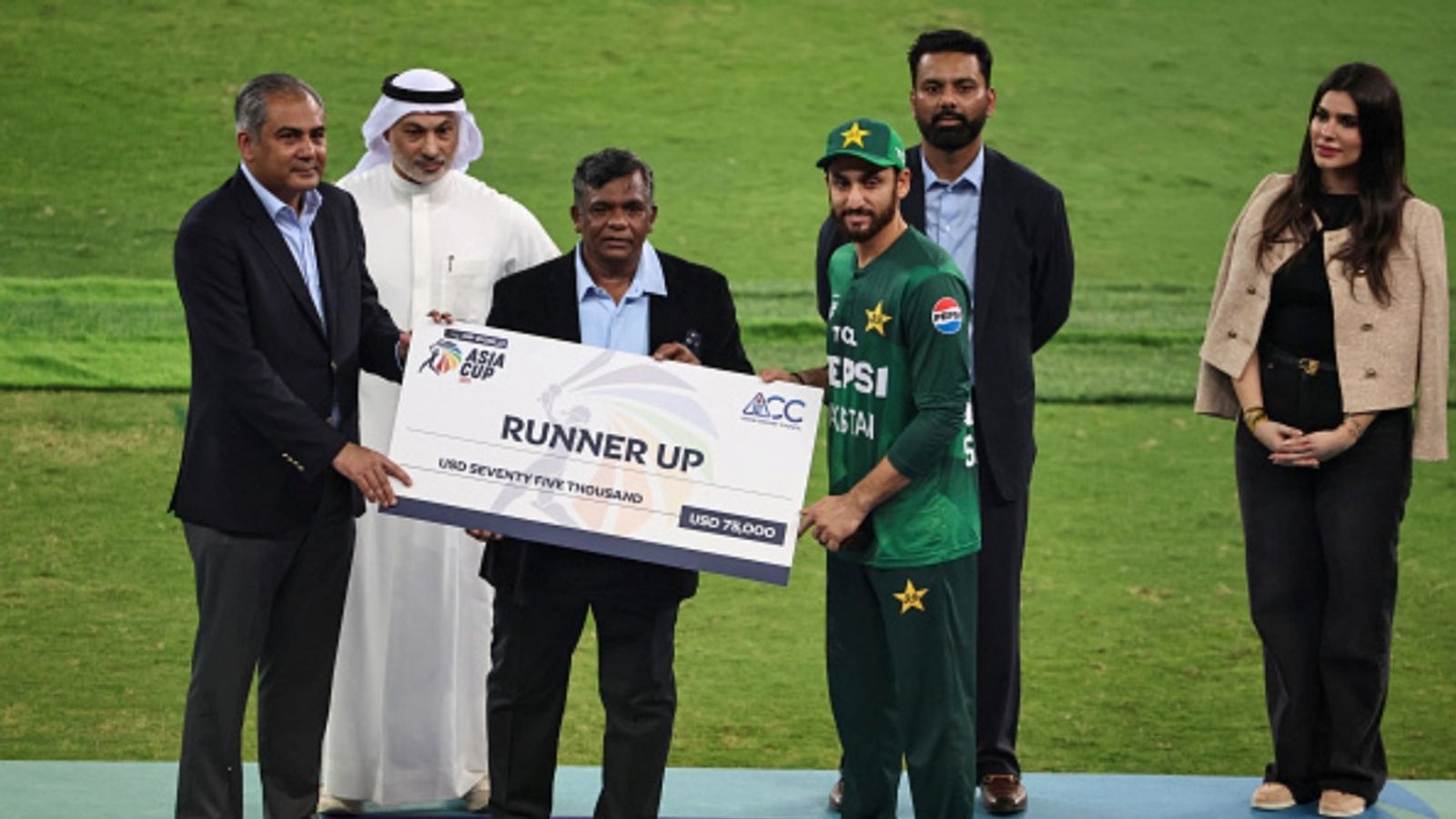 PCB chief Mohsin Naqvi apologises to BCCI but still refuses to return T20 Asia Cup 2025 trophy and medals to India Pakistan's captain Salman Agha (R) receives the runner up cheque from ACC and PCB chairman Mohsin Naqvi during the presentation ceremony at the end of the Asia Cup 2025 T20 final against India at the Dubai International Stadium on September 28, 2025.
