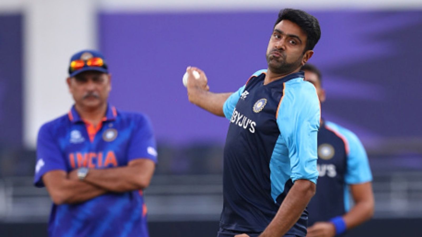 'You have no business outside...': Ravi Shastri's 'first message' to all BBL batters ahead of R Ashwin's debut goes viral Ravichandran Ashwin of India bowls and is watched by Ravi Shastri, Head Coach of India during the warm up prior to the ICC Men's T20 World Cup match against New Zealand at Dubai International Stadium on October 31, 2021 in Dubai, United Arab Emirates.