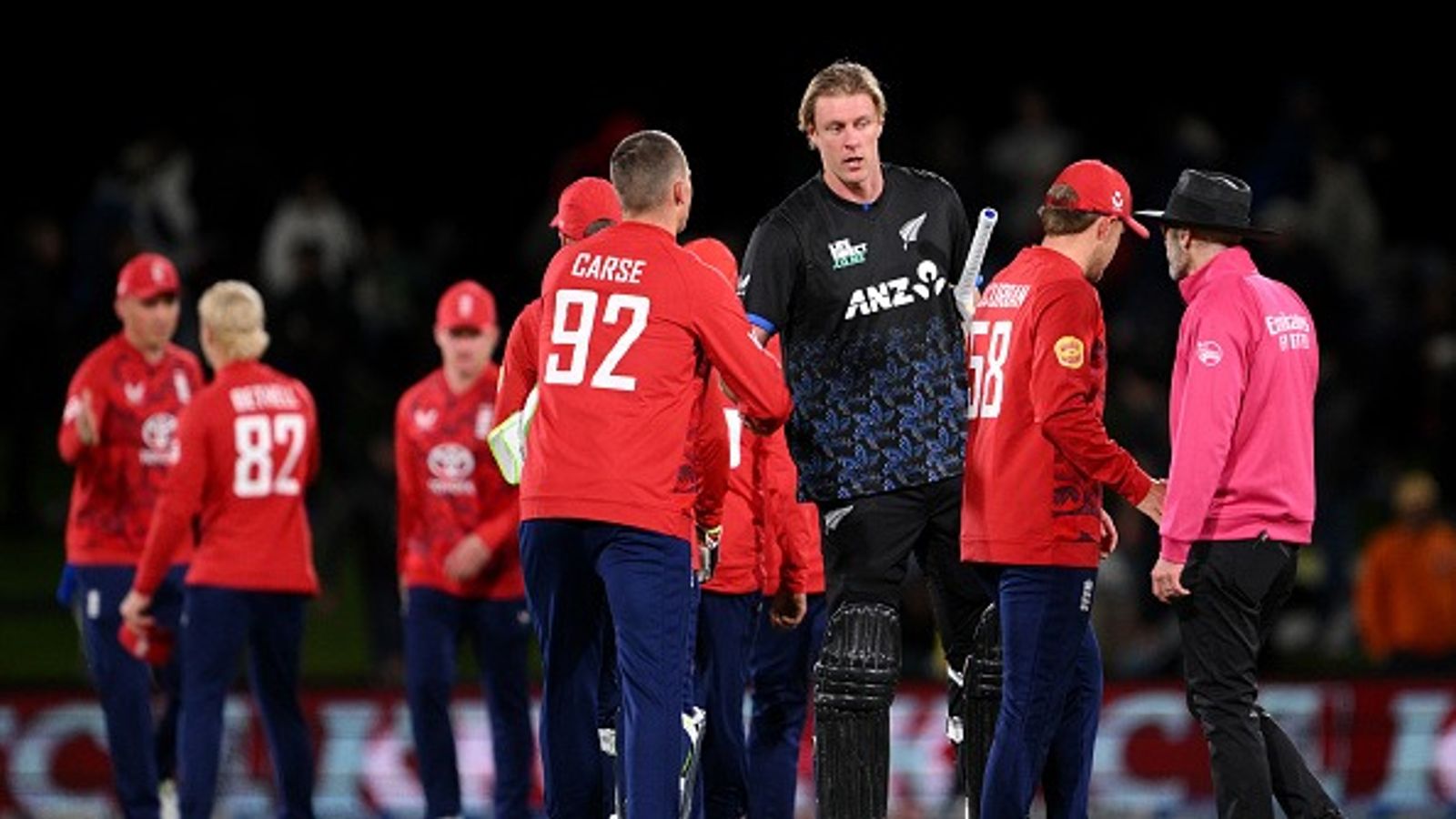 Harry Brook and Phil Salt power England to a dominant 65-run win over New Zealand as hosts fall short despite all wickets falling to catches : Brydon Carse of England and Kyle Jamieson of New Zealand shake hands following the second match in the T20 International series between New Zealand and England at Hagley Oval
