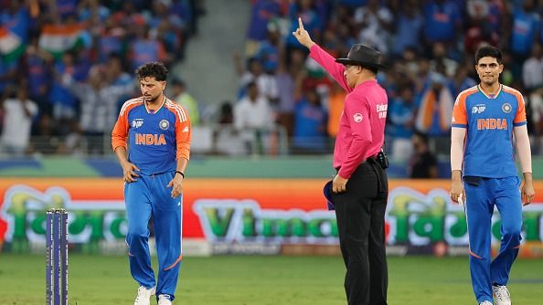 Kuldeep Yadav of India celebrates the wicket alongside Shubman Gill