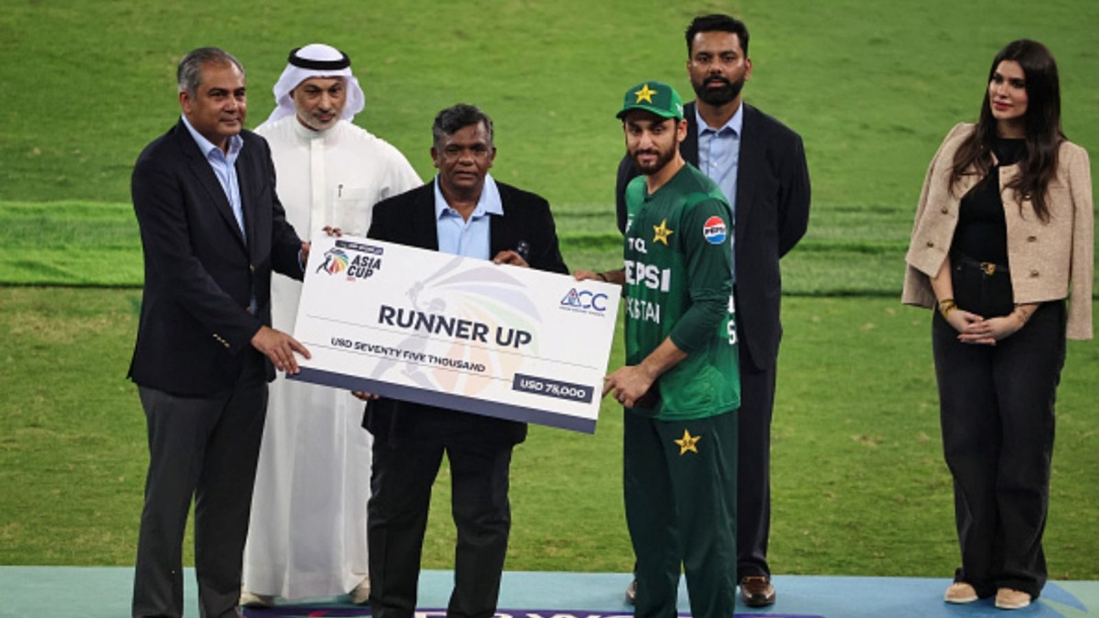 BCCI writes letter to ACC, warns Mohsin Naqvi about consequences if Asia Cup 2025 trophy not handed over to Champions India Pakistan's captain Salman Agha (R) receives the runner up cheque from ACC and PCB chairman Mohsin Naqvi at the end of the Asia Cup 2025 match against India at the Dubai International Stadium in Dubai on September 28, 2025.