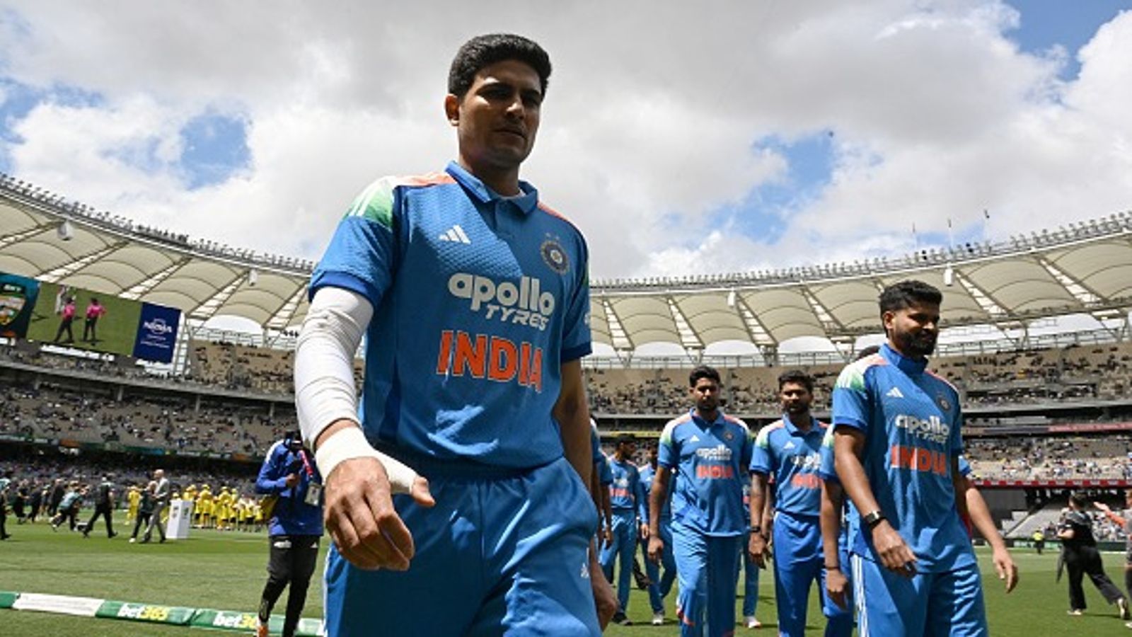 'We had just enough runs but...': Shubman Gill blames 3 stars for India's series-losing defeat against Australia in 2nd ODI India's captain Shubman Gill (L) escorts his team off the field in this frame