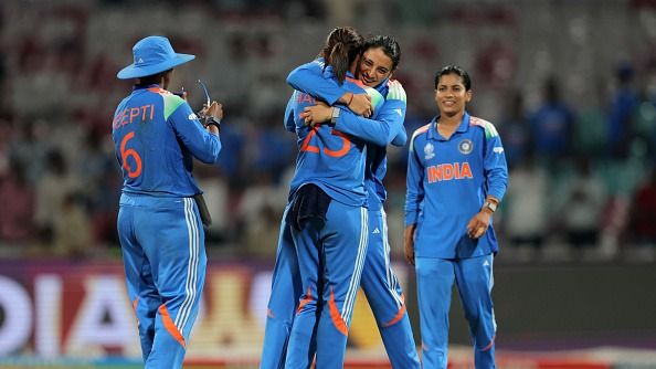 Smriti Mandhana of India celebrates with team mate Harmanpreet Kaur following victory in the ICC Women's Cricket World Cup India 2025 match between India and New Zealand at DY Patil Stadium