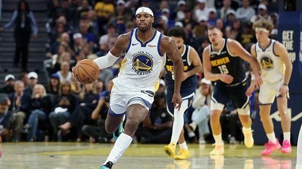 Buddy Hield #7 of the Golden State Warriors dribbles the ball against the Denver Nuggets at Chase Center on October 23, 2025 in San Francisco, California.
