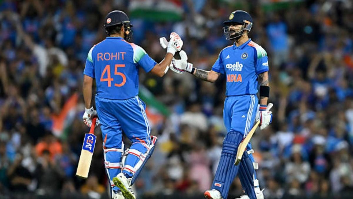 Virat Kohli of India is congratulated by teammate Rohit Sharma after completing a half century (50 runs) during game three of the One Day International series between Australia and India