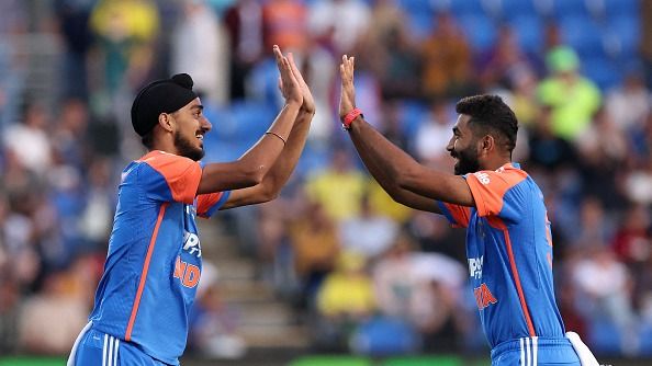rshdeep Singh (L) celebrates his wicket of Australia's Travis Head with teammate Jasprit Bumrah during the third Twenty20 cricket international match between Australia and India at Bellerive Oval in Hobart