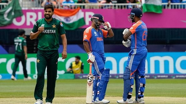 Pakistan's Haris Rauf looks on as India's Rishabh Pant talks with teammate Suryakumar Yadav after Pant hit four during the ICC men's Twenty20 World Cup 2024