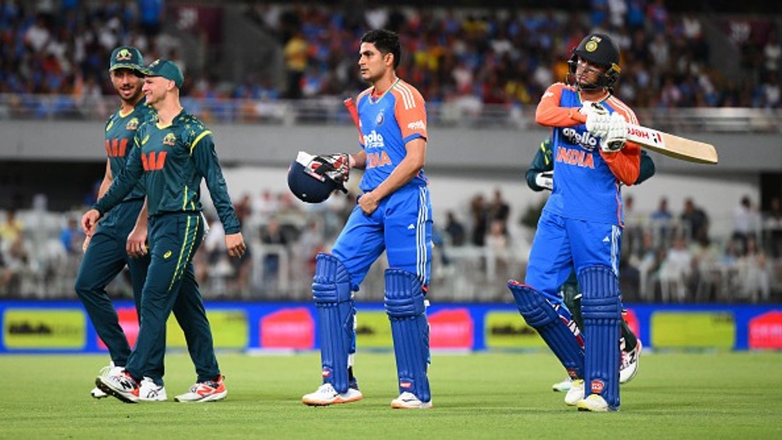 IND vs AUS: India seal series 2-1 as 5th T20I against Australia called off due to relentless rain at Gabba India's Shubman Gill (c) and Abhishek Sharma (R) leave the field along due to a severe weather warning during 5th T20I against Australia