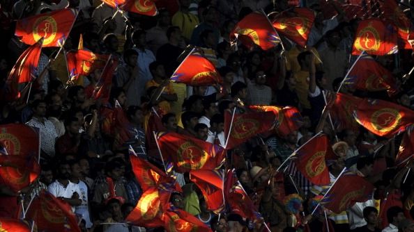 RCB appoint former England star as assistant coach ahead of 2026 season Royal Challengers Bangalore fans wave teams flags in this frame