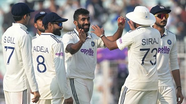India's Jasprit Bumrah (C) celebrates with his teammates in this frame