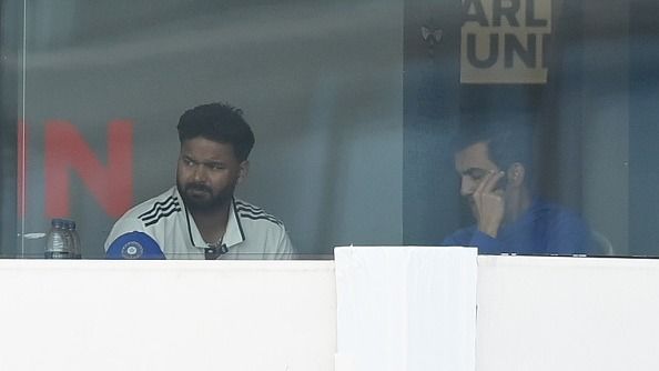 Rishabh Pant of India watches from the dressing room alongside coach Gautam Gambhir Rishabh Pant of India watches from the dressing room alongside coach Gautam Gambhir