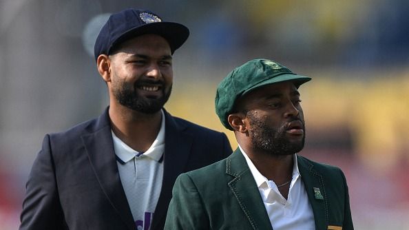 Rishabh Pant (L) and his South African counterpart Temba Bavuma look on after the toss before the start of the second Test cricket match between India and South Africa at the Barsapara Cricket Stadium 