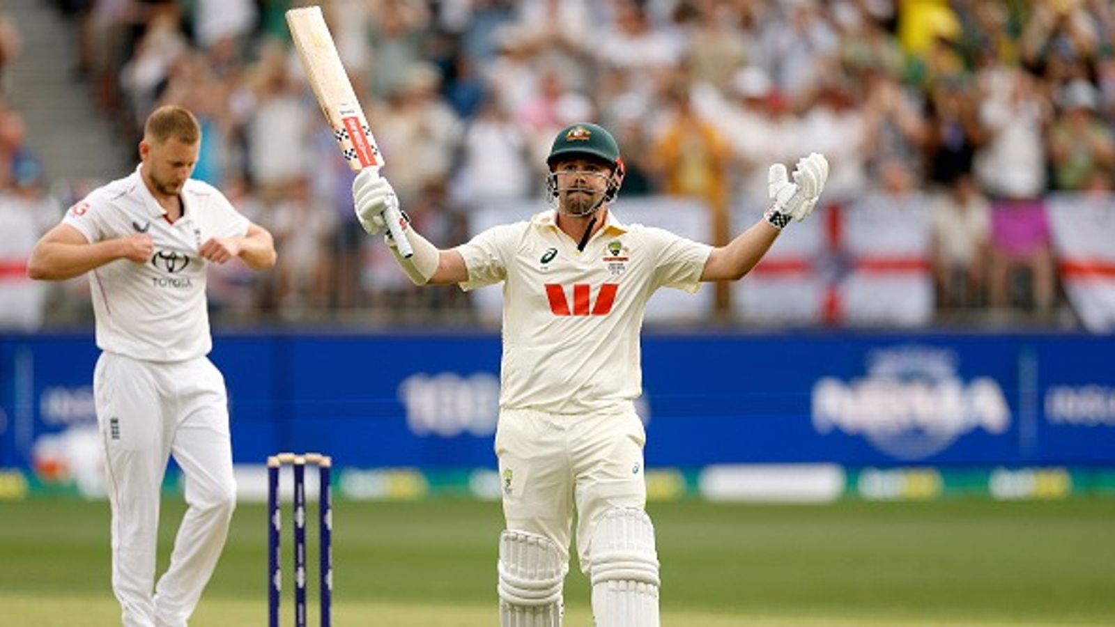 Travis Head’s explosive 123 and Mitchell Starc’s ten-wicket haul lead Australia to eight-wicket win in Ashes opener over England Travis Head of Australia raises his bat after scoring 100 runs during day two of the First 2025/26 Ashes Series Test Match between Australia and England at Perth Stadium on November 22, 2025