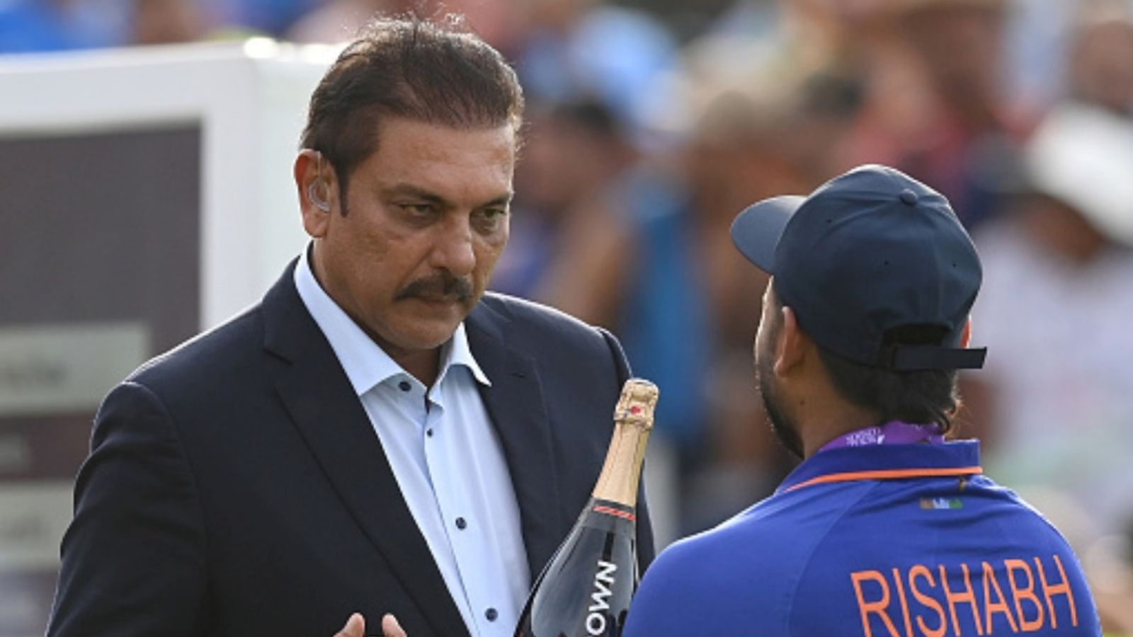 'Might have to even declare 80, 90, 100 runs behind and...': Ravi Shastri's suggestion to captain Rishabh Pant to force a win in Guwahati Rishabh Pant of India presents former coach Ravi Shastri with a bottle of champagne after India won the third ODI against England at Old Trafford on July 17, 2022 in Manchester, England.