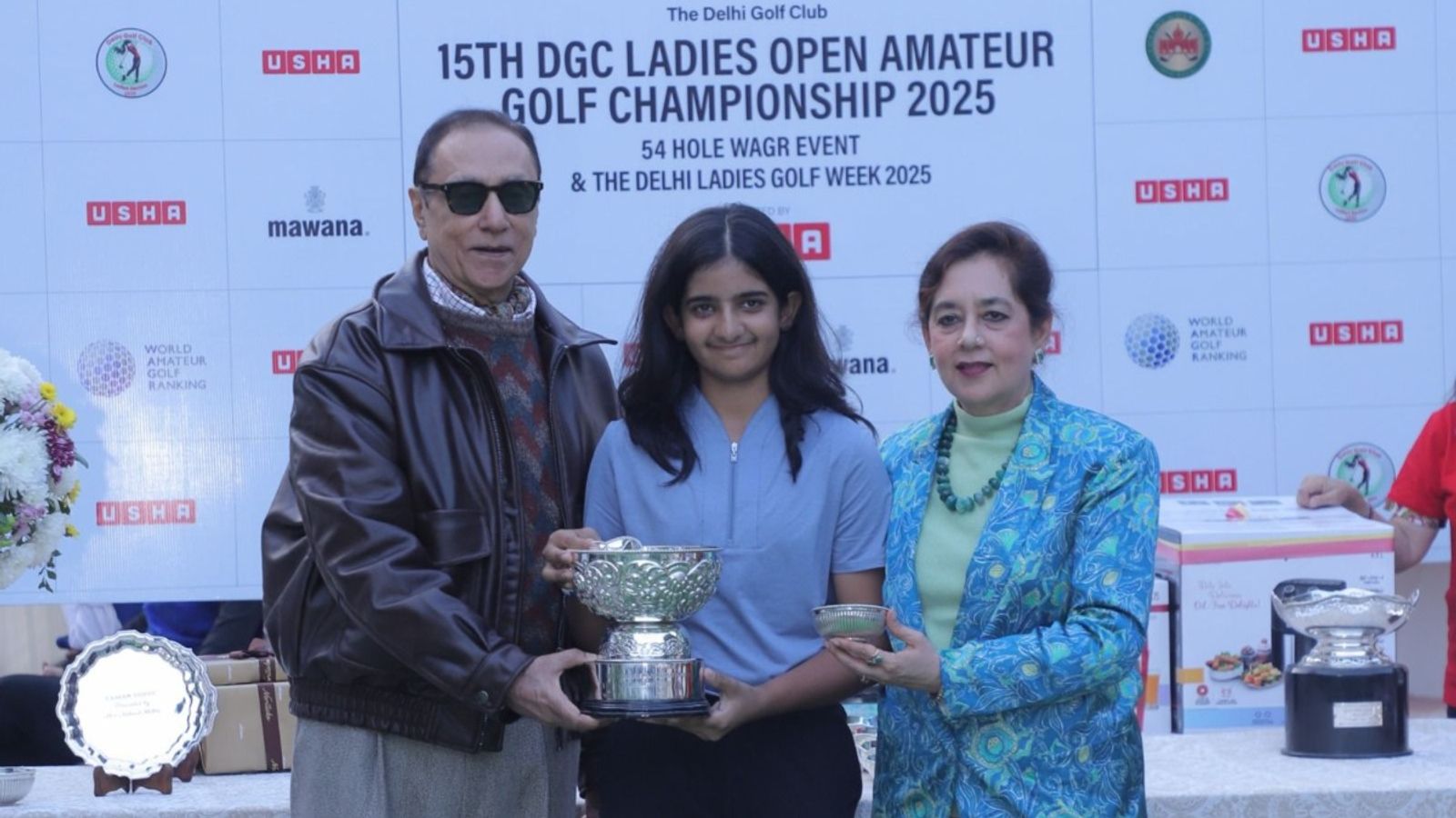 Ojaswini Saraswat triumphs at DGC Ladies Amateur Open 2025 as India’s rising golf talent shines Ojaswini Saraswat receives the trophy from Mr Raj Khosla Club President DGC and Lady Caption Mrs Mala Bawa at the 15th DGC Ladies Open Amatuer Golf Championsh.PG