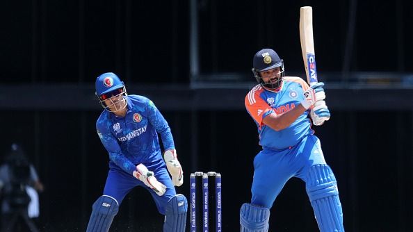  Rohit Sharma of India plays a shot as Rahmanullah Gurbaz of Afghanistan keeps during the ICC Men's T20 Cricket World Cup