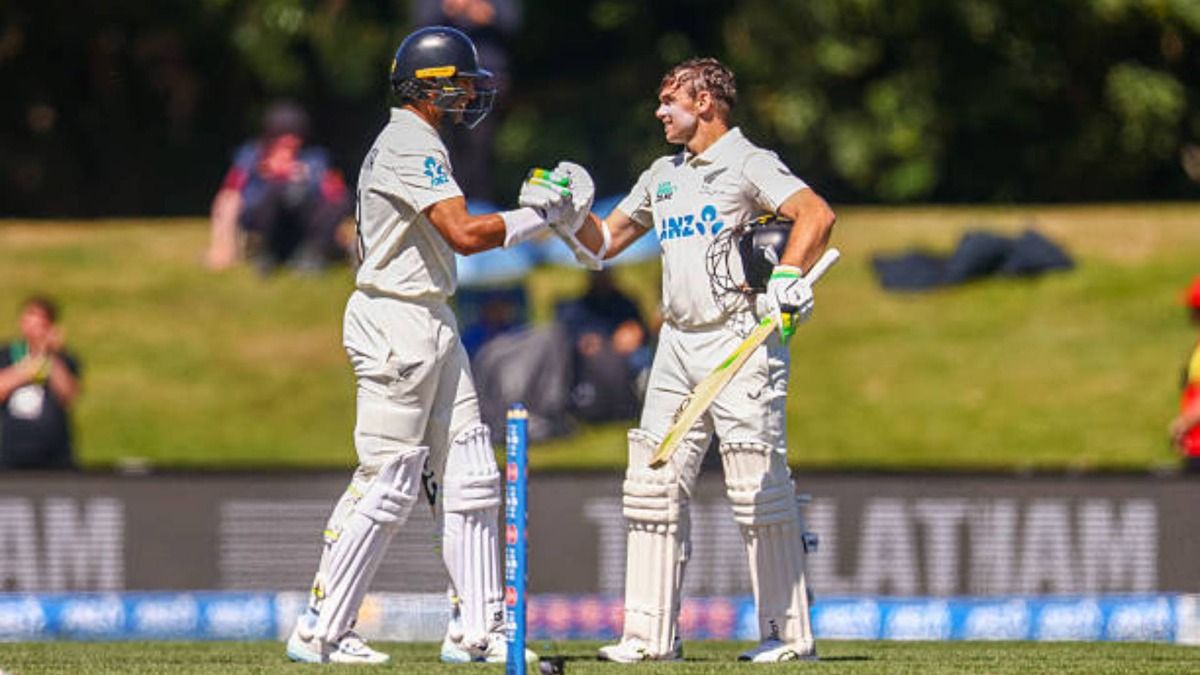 Rachin Ravindra and Tom Latham of New Zealand react during Day Three of the first match in the series between New Zealand and West Indies at Hagley Oval