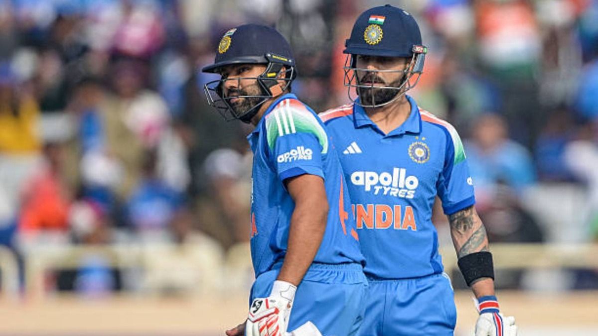 India's Virat Kohli (R) and Rohit Sharma take a break during the first one-day international (ODI) cricket match between India and South Africa at the JSCA International Stadium in Ranchi