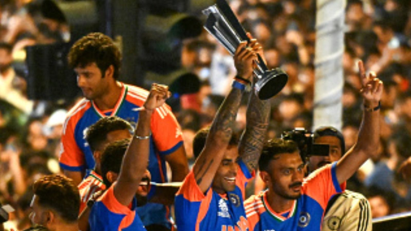 JioStar, ICC clarify media rights deal amid speculation ahead of T20 World Cup 2026 Suryakumar Yadav (C) holds the trophy as he greets fans during an open bus roadshow in Mumbai on July 4, 2024, after winning the ICC men's Twenty20 World Cup in Barbados.