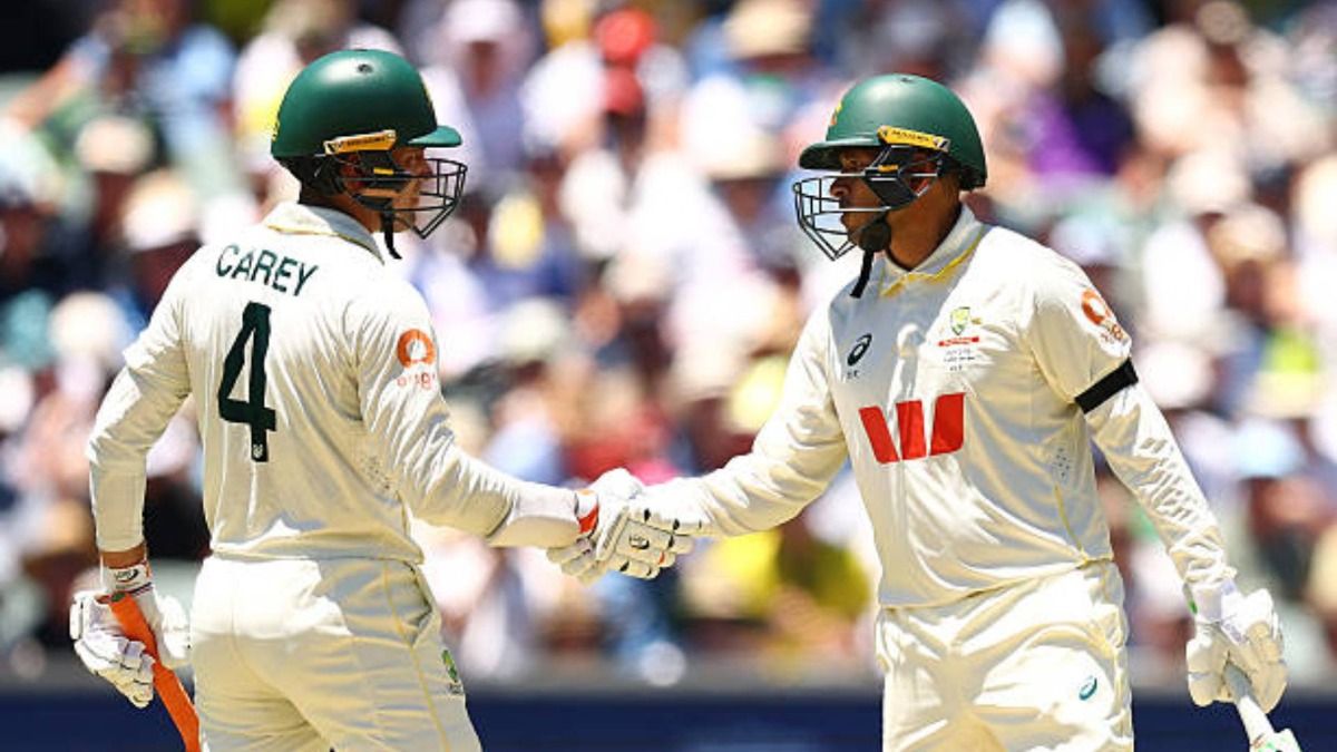 Alex Carey of Australia congratulates Usman Khawaja of Australia after making a half century during day one of the Third Test Match in the 2025-26 Ashes Series between Australia and England