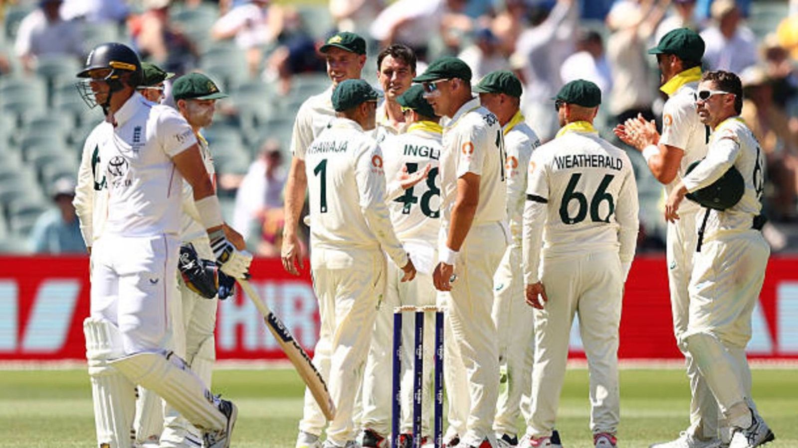 The Ashes, 3rd Test: Troika of Cummins, Lyon and Boland helps Australia take control, finish Day 2 with 158-run lead Pat Cummins of Australia celebrates with team mates after the wicket of Jamie Smith of England for 22 runs during day two of the Third Test Match in the 2025-26 Ashes Series (via Getty)