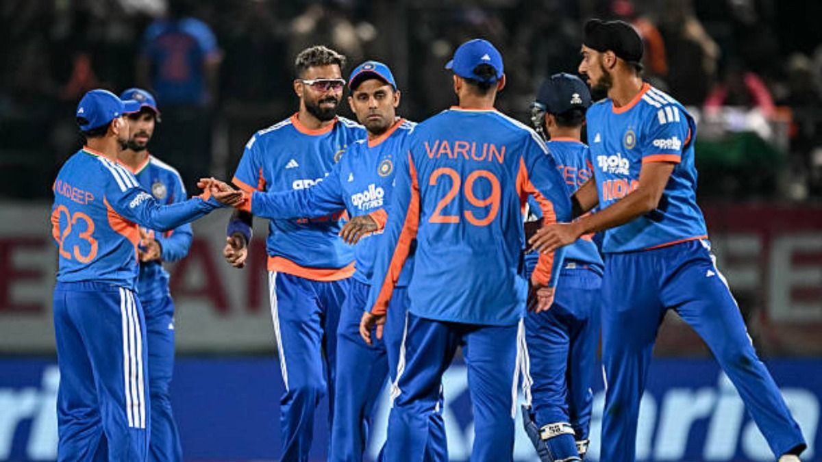 India's captain Suryakumar Yadav (C) celebrates with teammates after the dismissal of South Africa's Ottneil Baartman during the third Twenty20 international cricket match between India and South Africa (via Getty)