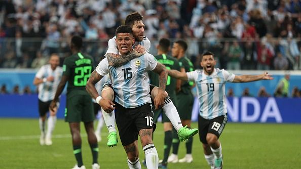 Group D, 3rd game day, Nigeria vs Argentina at the St. Petersburg Stadium: Argentina's goal scorer Marcos Rojo celebrates his 1-2 goal with Lionel Messi (top)