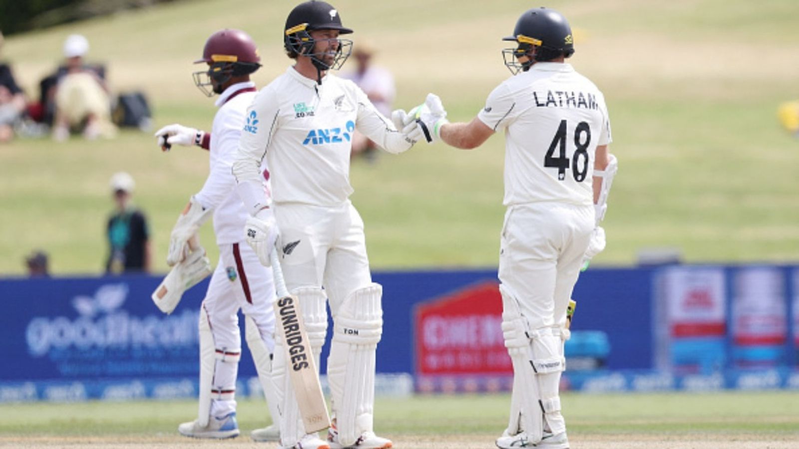 RECORD ALERT! Devon Conway, Tom Latham become 1st opening pair to score century in both innings of a Test New Zealand's Devon Conway (L) and Tom Latham touch gloves during day 4 of the 3rd Test against West Indies.