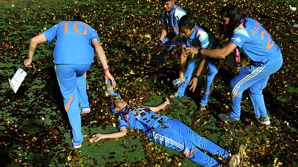 India's Jemimah Rodrigues (C) celebrates with her teammates after India won Women's ODI World Cup title