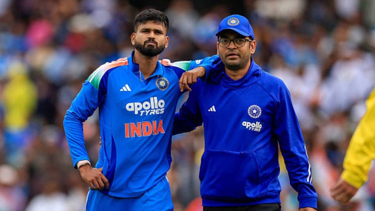 Shreyas Iyer of India is assisted off the field with an injury during game three of the One Day International series between Australia and India at Sydney Cricket Ground (via Getty)