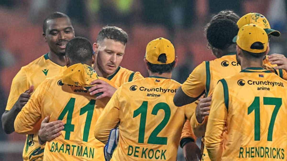 South Africa's players celebrate after winning the second Twenty20 international cricket match between India and South Africa at the Maharaja Yadavindra Singh International Cricket Stadium (via Getty)