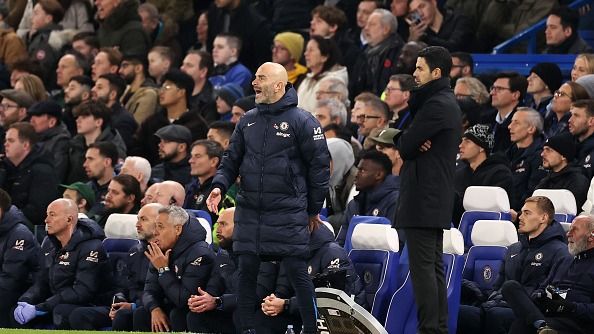 Enzo Maresca, Manager of Chelsea, reacts alongside Mikel Arteta, Manager of Arsenal, as he looks on during the Premier League match between Chelsea FC and Arsenal FC at Stamford Bridge on November 10, 2024 in London, England.