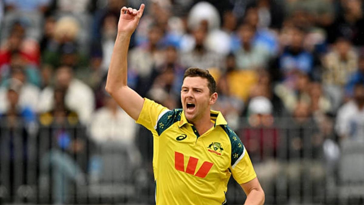 Australia's Josh Hazlewood celebrates taking the wicket of India's Shreyas Iyer during the first one-day international cricket match between Australia and India (via Getty)