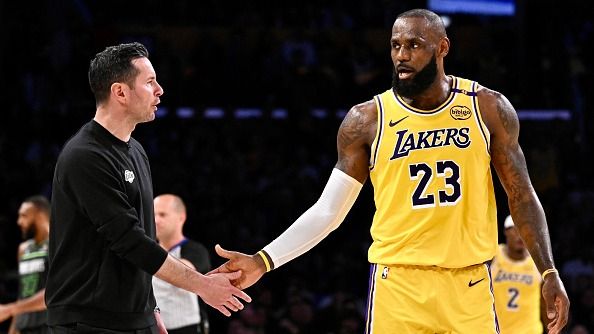 Head coach JJ Redick of the Los Angeles Lakers high fives LeBron #23 of the Los Angeles Lakers in the first half of game 5 of a first round NBA basketball game against the Minnesota Timberwolvesat rena in Los Ange