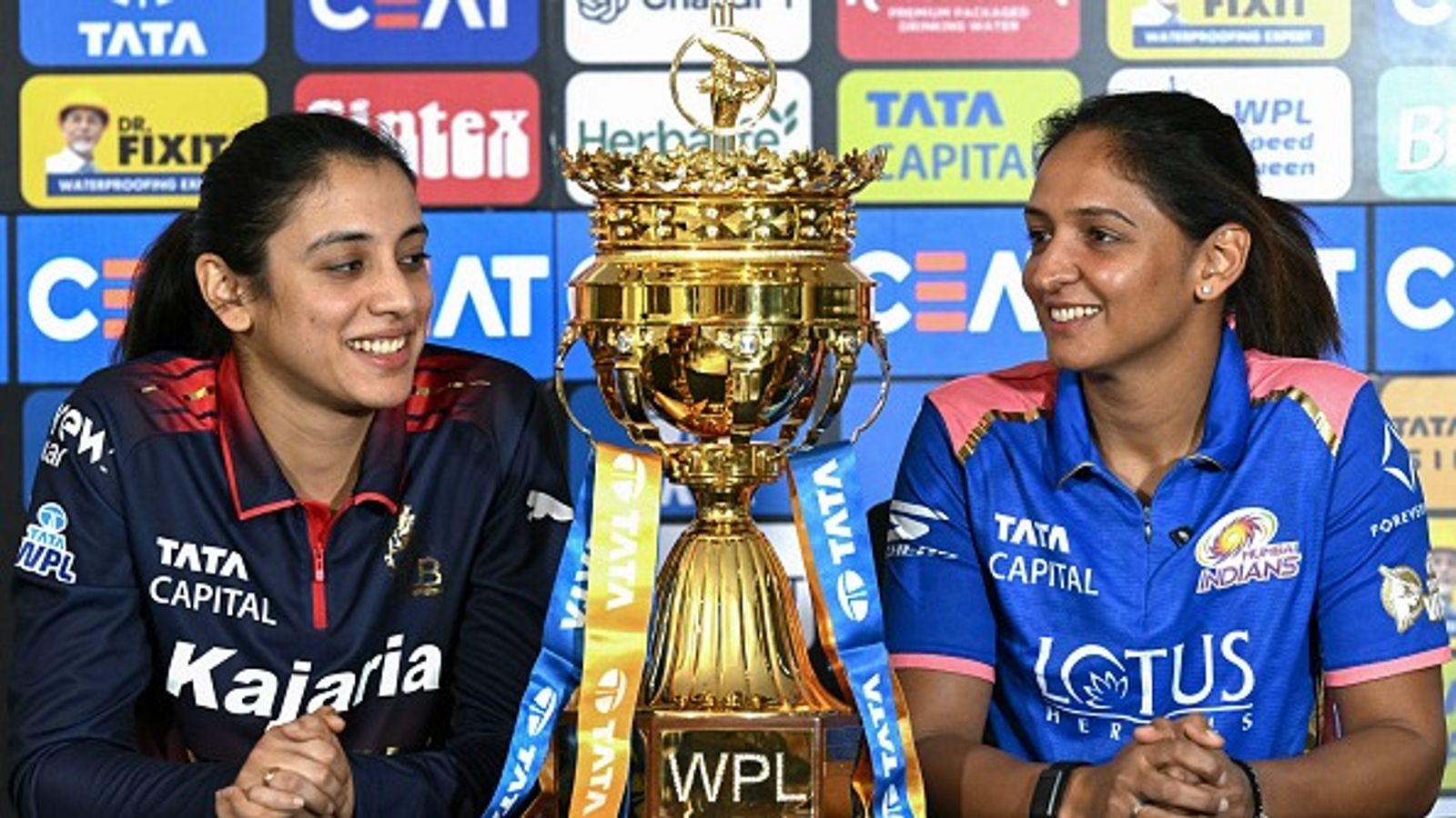 MI vs RCB Live Streaming: When and where to watch Women’s Premier League opener clash online and on TV MI vs RCB, WPL 2026: Royal Challengers Bengaluru's captain Smriti Mandhana (L) and Mumbai Indians' captain Harmanpreet Kaur look at the trophy (Getty)