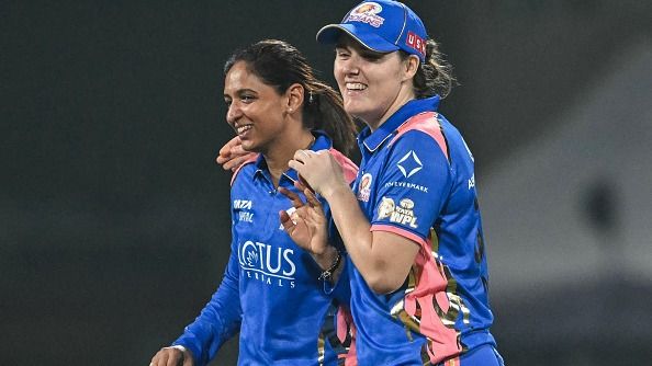 Mumbai Indians' Nat Sciver-Brunt (R) and captain Harmanpreet Kaur celebrate with each other in this frame. (Getty)