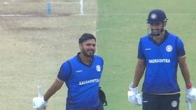 Harvik Desai celebrating his century against UP Harvik Desai celebrating his century against UP