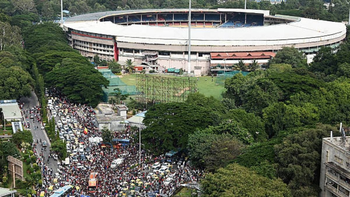 Fans throng outside the M. Chinnaswamy Stadium in Bengaluru on June 4, 2025, to celebrate a day after Royal Challengers Bengaluru's victory at the Indian Premier League (IPL) Twenty20 final cricket match (via Getty)