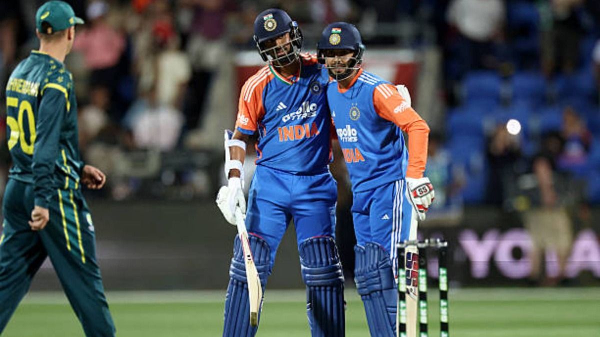 India's Washington Sundar (C) and Jitesh Sharma celebrate victory in the third Twenty20 cricket international match between Australia and India at Bellerive Oval in Hobart (via Getty)