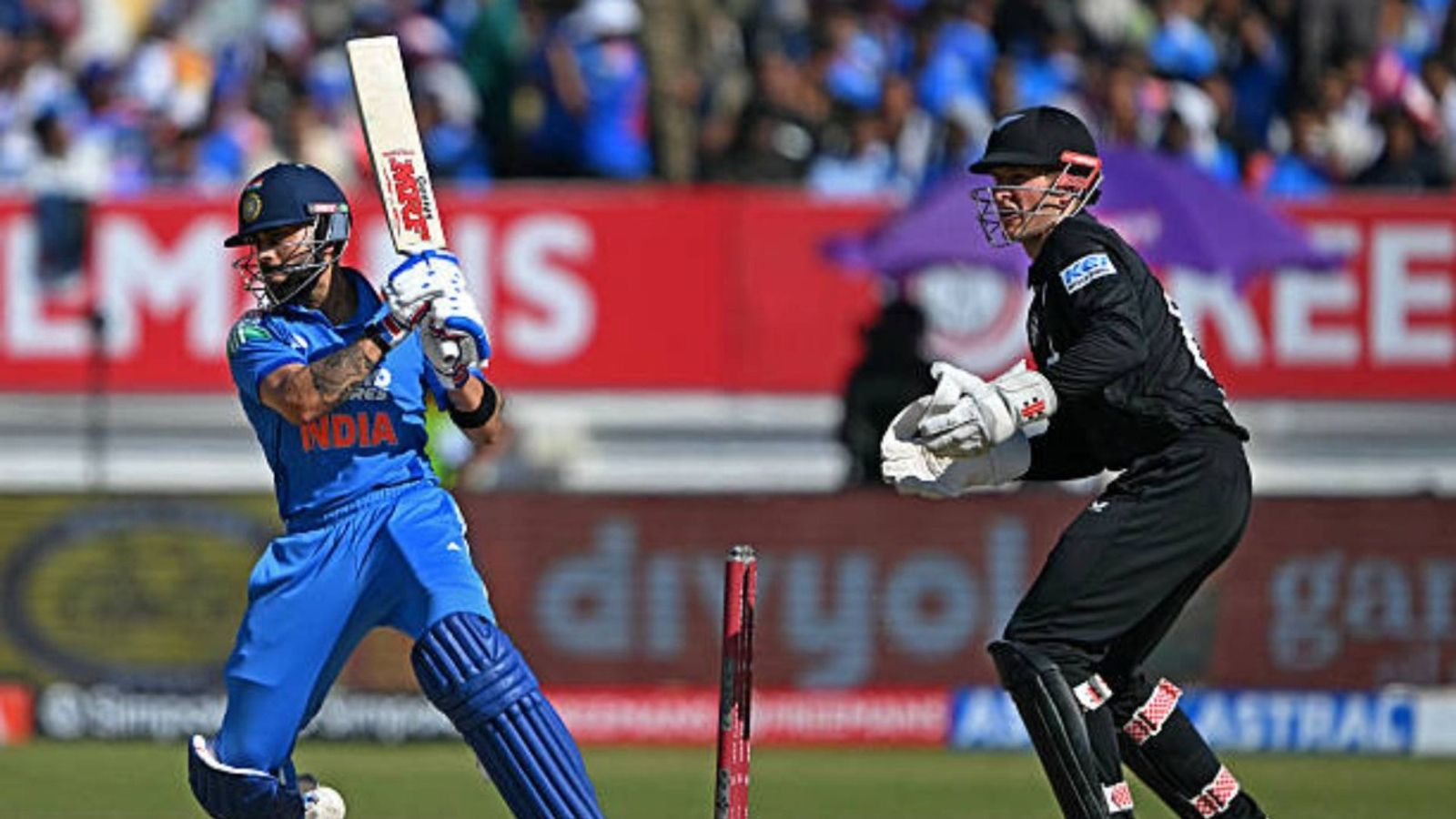 Virat Kohli dethrones Sachin Tendulkar, clinches this stunning feat in 2nd ODI vs NZ India's Virat Kohli (L) plays a shot during the second one-day international (ODI) cricket match between India and New Zealand at Niranjan Shah Stadium in Rajkot (via Getty)