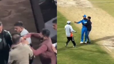 Watch: Match official ignores Kohli's request, slaps fan who breached security in IND vs NZ 2nd ODI Match official ignores Virat Kohli's request, slaps fan who breached security during IND vs NZ 2nd ODI. (Screengrab)