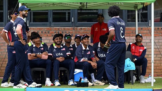 Explained: Why USA cricketers' parents sang Indian National Anthem during U-19 WC clash vs India USA cricketers interact as they wait during a delay in play during the U19 World Cup clash against India. (Getty)