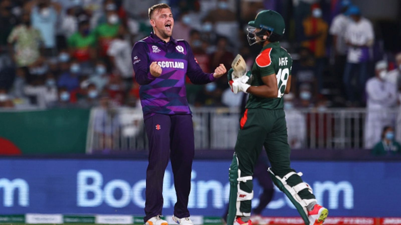 ICC yet to contact Bangladesh's potential replacement Scotland for T20 World Cup 2026 if BCB pulls out: Report Mark Watt of Scotland celebrates the wicket of Afif Hossain of Bangladesh during the ICC Men's T20 World Cup match at Oman Cricket Academy Ground on October 17, 2021 in Muscat, Oman.