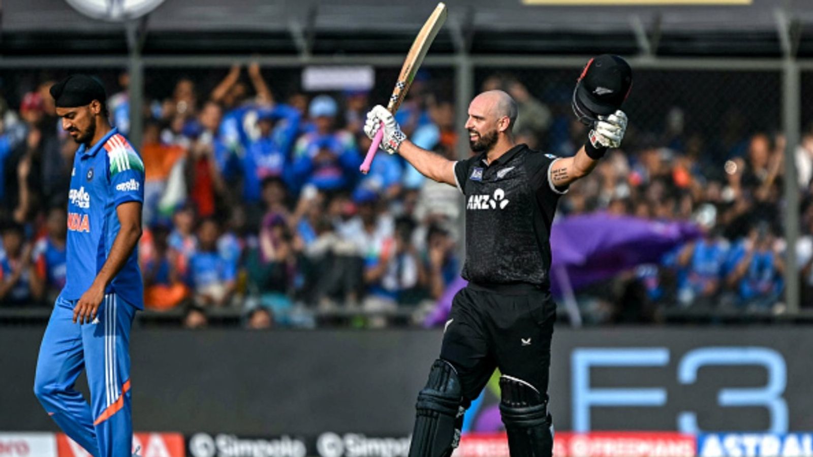 Santner's message to red-hot Daryl for T20I series vs India: 'Hope he does something similar' New Zealand's Daryl Mitchell (R) celebrates after scoring a century during the third ODI at the Holkar Cricket Stadium in Indore on January 18, 2026.