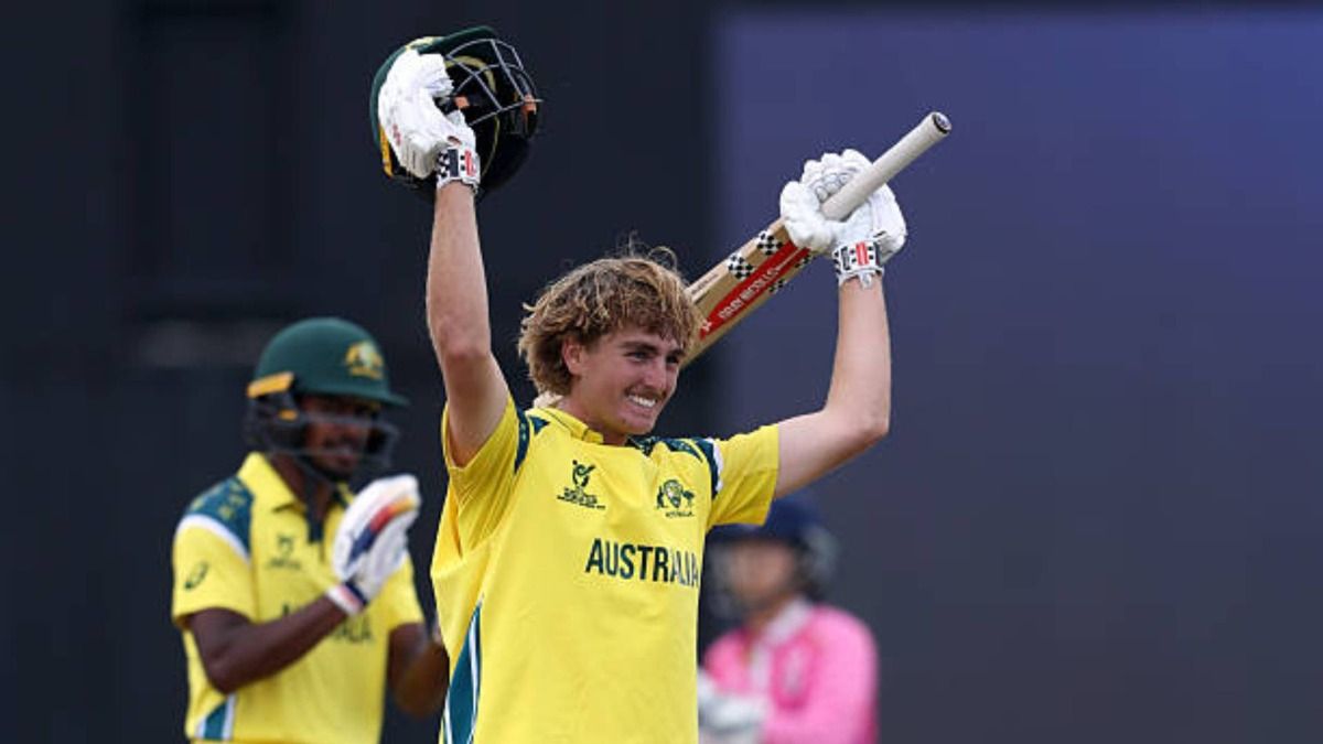 Will Malajczuk of Australia celebrates reaching his century during the ICC U19 Men's Cricket World Cup 2026 match between Australia and Japan at Namibia Cricket Ground (via Getty)