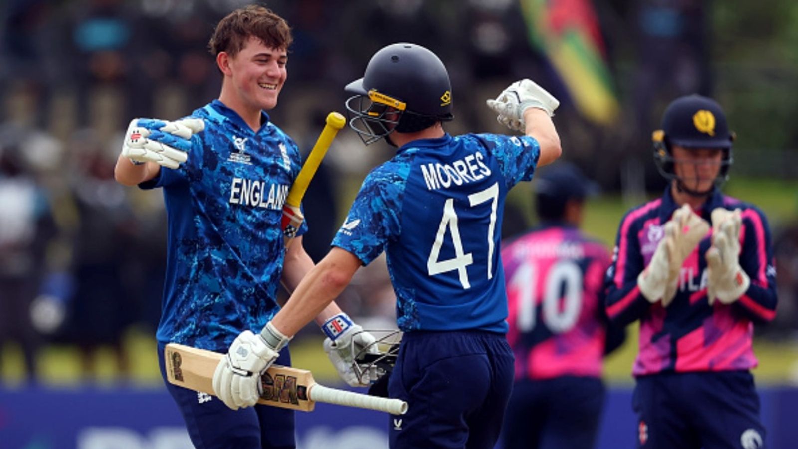 England's Ben Mayes slams 191 against Scotland, misses breaking all-time U19 World Cup record by 2 runs Ben Mayes of England celebrates with teammate Joe Moores after reaching his century during the ICC U19 Men's World Cup 2026 match against Scotland at Takashinga Sports Club on January 21, 2026 in Harare, Zimbabwe.