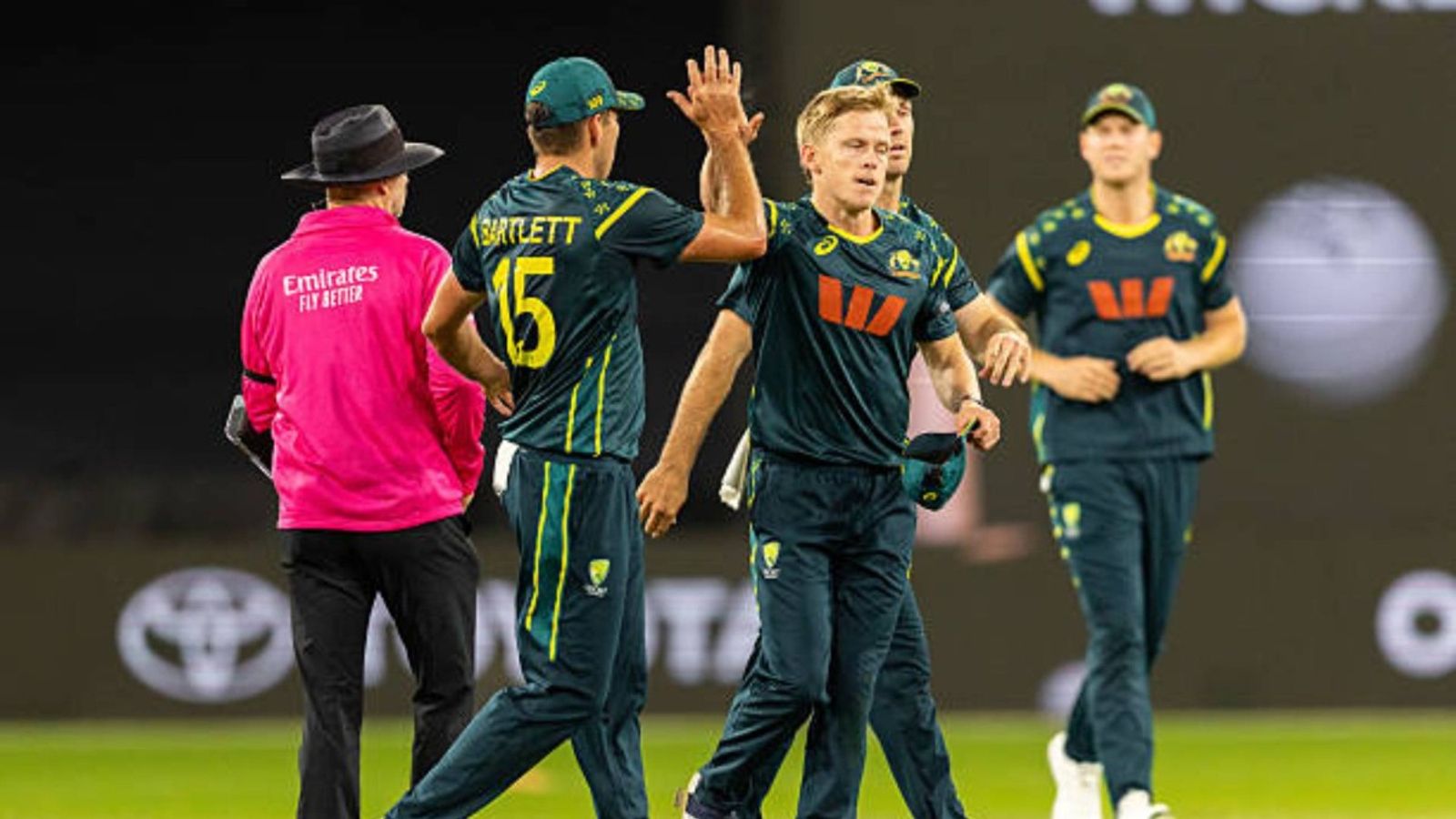 Massive setback for Australia as star pacer ruled out of BBL finals due to injury, doubtful for T20 World Cup Nathan Ellis of Australia is congratulated by his team mates after taking a wicket during the 2nd match of the BKT Tyres Men's T20I Series between Australia and India at Melbourne Cricket Ground (via Getty)