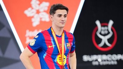 Gavi central midfield of Barcelona and Spain celebrates with the trophy after winning the Spanish Super Cup final match between FC Barcelona and Real Madrid at King Abdullah Sports City Hall Stadium on January 11, 2026 in Jeddah, Saudi Arabia.