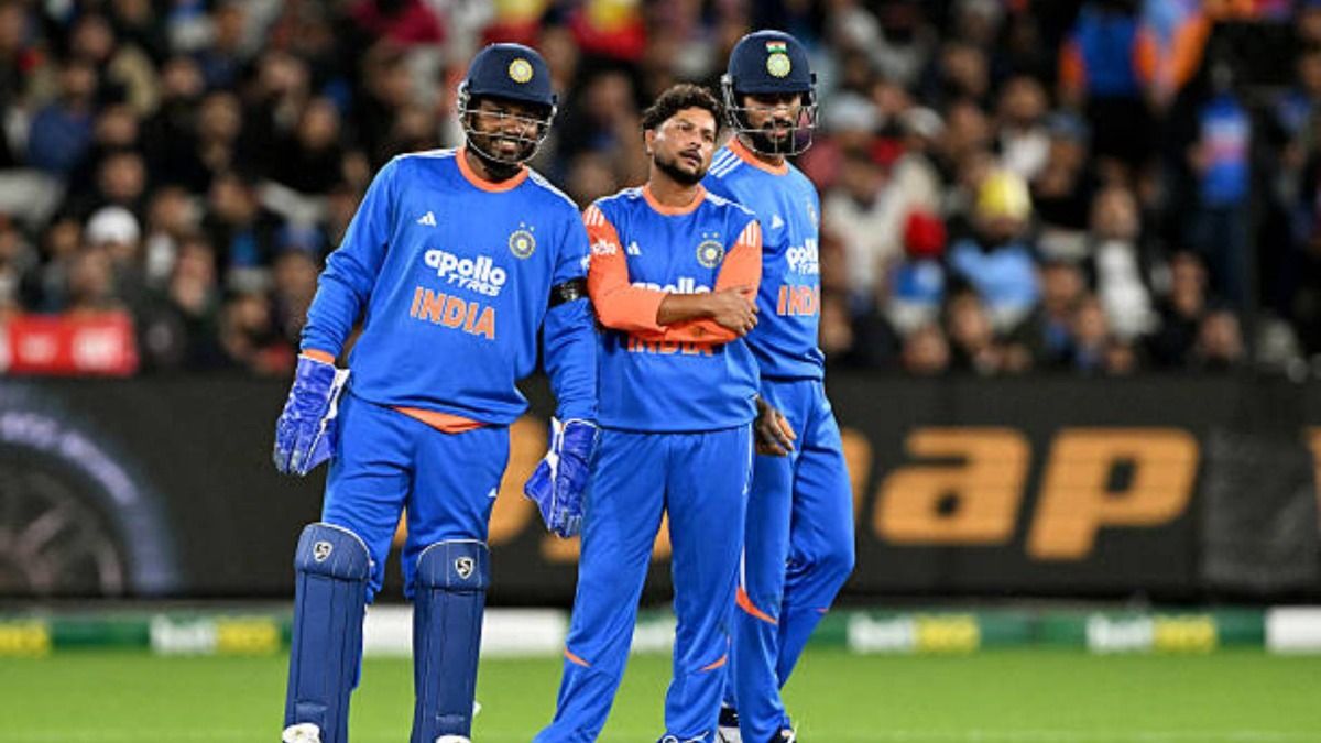 India's Kuldeep Yadav (C) awaits an LBW decision with teammates Sanju Samson (L) and Tilak Varma (R) during the second T20 international cricket match between Australia and India at the Melbourne Cricket Ground (via Getty)