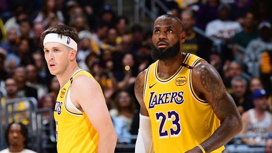 Austin Reaves #15 and LeBron James #23 of the Los Angeles Lakers looks on during the game against the Minnesota Timberwolves during Round 1 Game 2 of the 2025 NBA Playoffs on April 22, 2025 at Crypto.Com Arena in Los Angeles, California.